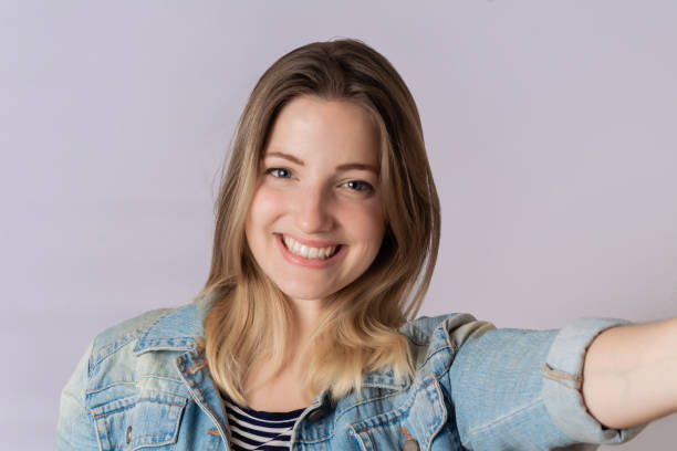 istock Young woman taking selfie 1140135573
