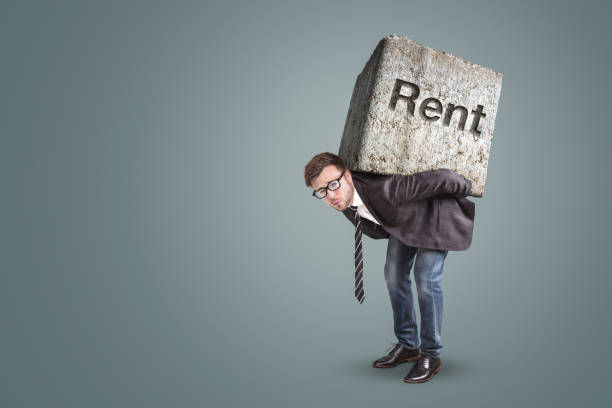 istock Man carrying a large stone engraved with the word 