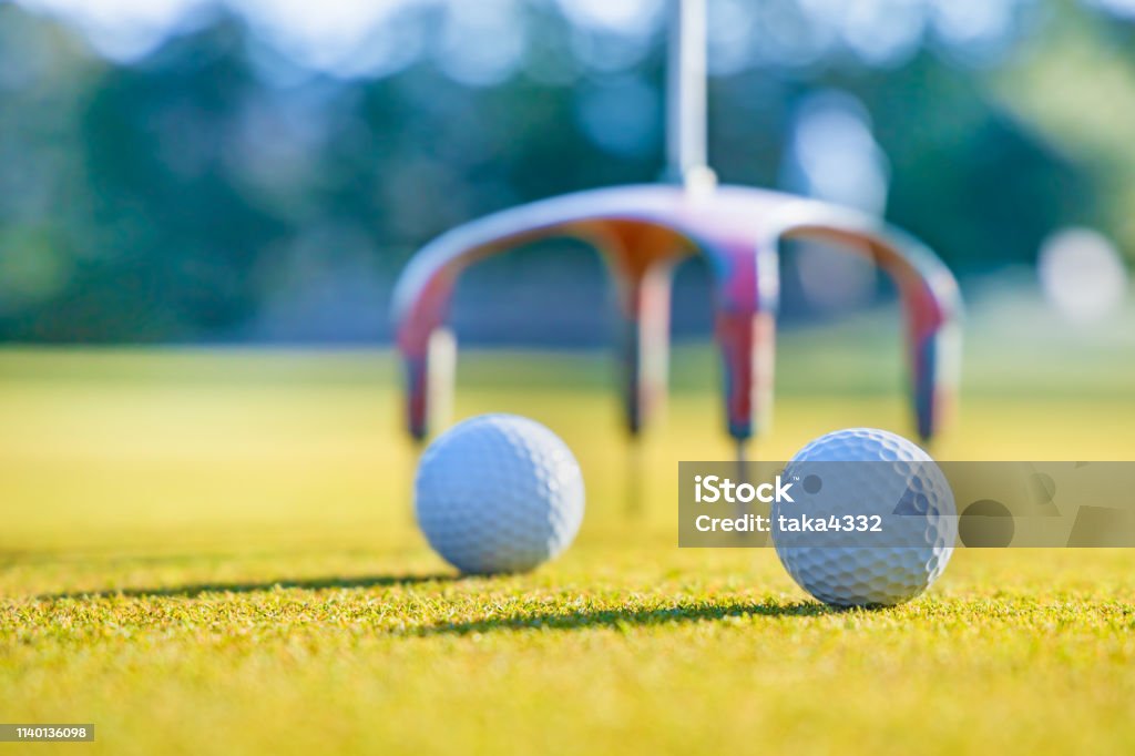 Golf course green and ball Golf Course Stock Photo