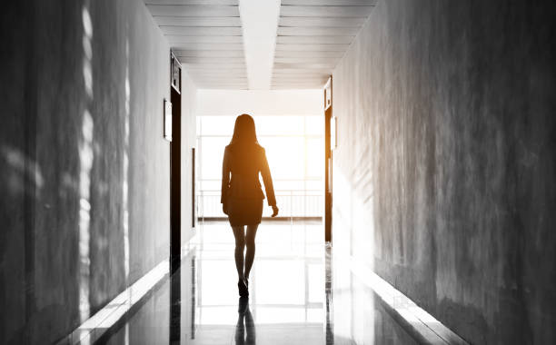 istock Businesswoman through the office corridor 1140137574