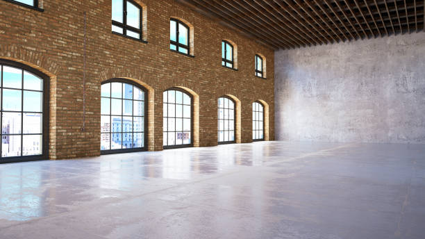 istock Empty Large Warehouse with Brick Walls and Windows 1140138874