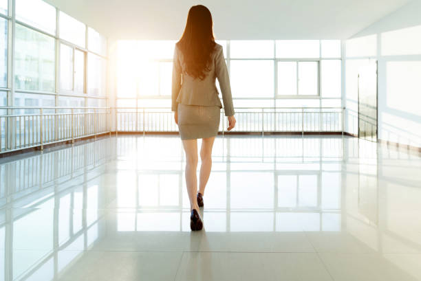 Businesswoman walking on empty office