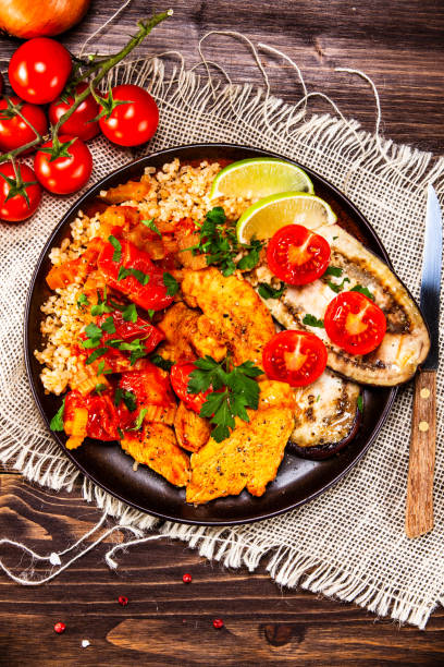 istock Grilled steaks with groats and vegetables 1140139570
