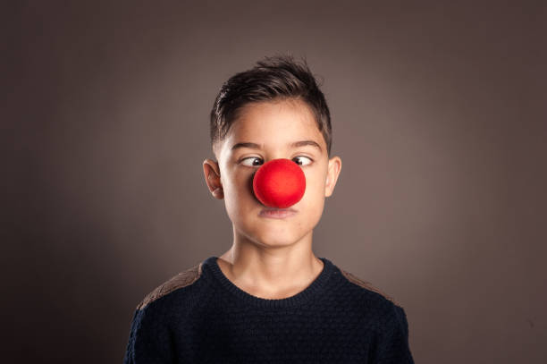 istock kid with a clown nose 1140139777