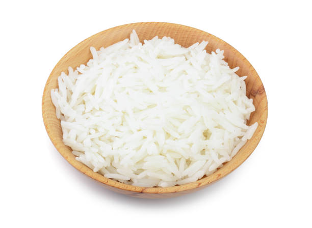 istock rice in a wooden bowl isolated on white background. Top view. Flat lay 1140140404