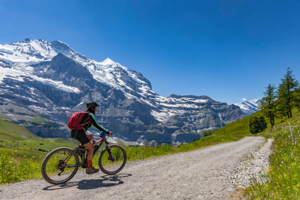 istock senior woman Mountain Biking in Grindelwald 1140140499