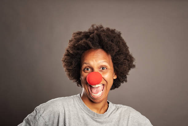 istock woman with a clown nose 1140140834