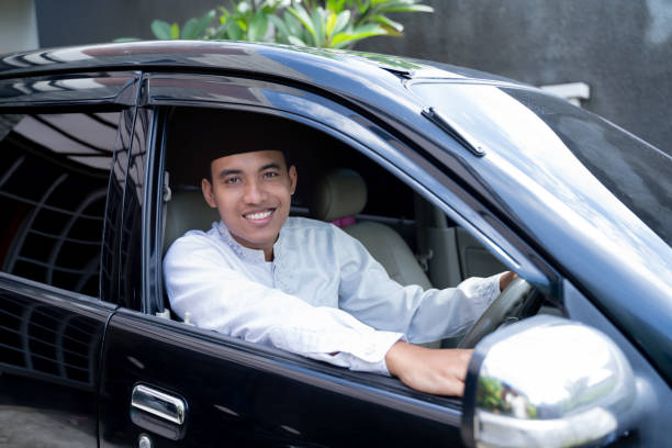 istock asian muslim with head cap driving a car 1140141471