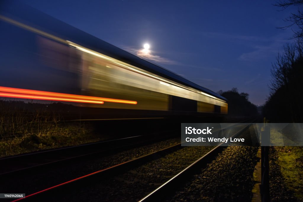 Moonlight train By the railway Night Stock Photo