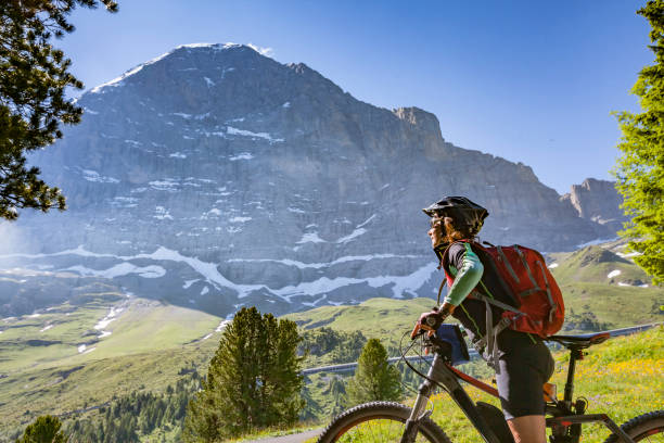 istock senior woman Mountain Biking in Grindelwald 1140142485