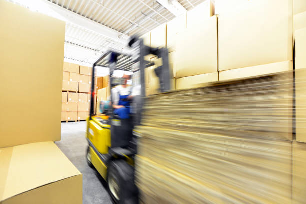 istock forklift driver in a warehouse for industrial goods 1140143149