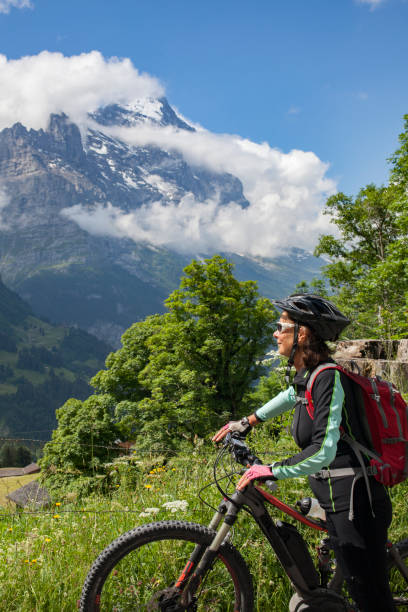 istock senior woman Mountain Biking in Grindelwald 1140144501