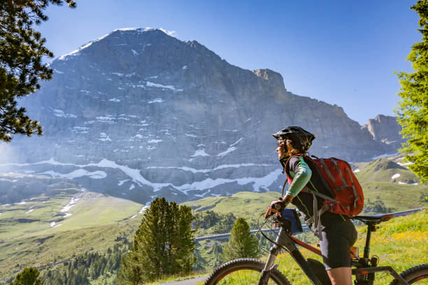 istock senior woman Mountain Biking in Grindelwald 1140144821