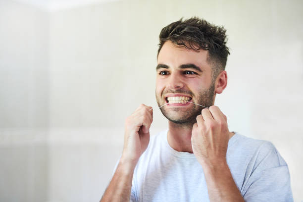 istock Flossing his way to a healthier smile 1140145353