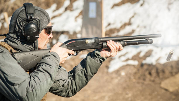 istock Tactical combat pump gun shooting training. Shotgun weapon action course 1140145503