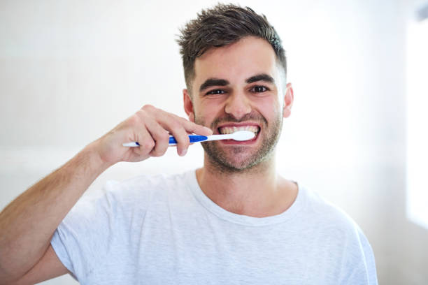 3,400+ Young Man Brushing Teeth Stock Photos, Pictures & Royalty-Free ...