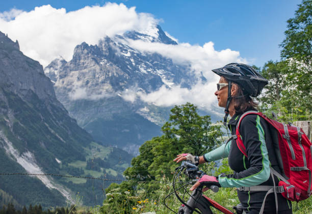 istock senior woman Mountain Biking in Grindelwald 1140145764