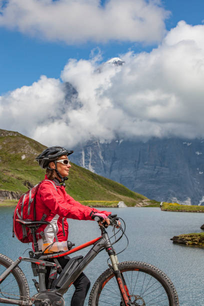 istock senior woman Mountain Biking in Grindelwald 1140146253