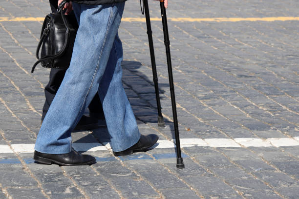 istock People walking with cane on a street 1140147098