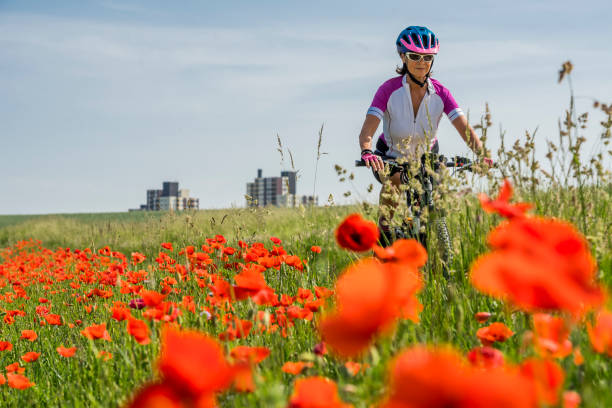 istock Woman mountain biking in spring 1140147731