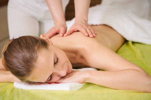 istock Woman enjoying classical neck and shoulder massage 1140148747