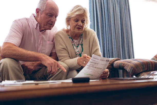 istock Couple discussing over medical bill while sitting on sofa 1140149464