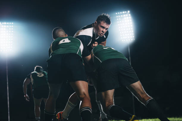 istock Rugby player tackled opponent team 1140150666