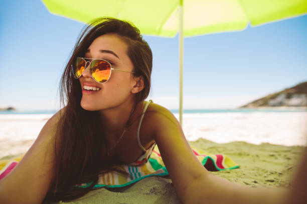 istock Woman enjoying vacation at the beach 1140150797
