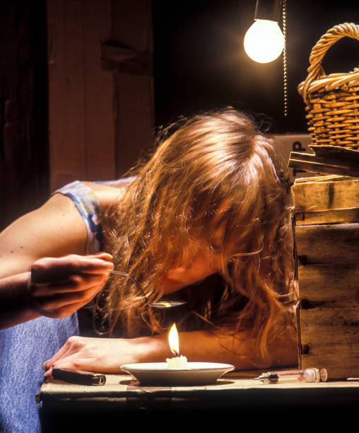 istock Woman Using Heroin in Grungy Room 1140150821