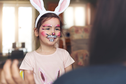 Little girl having a rabbit painting face
