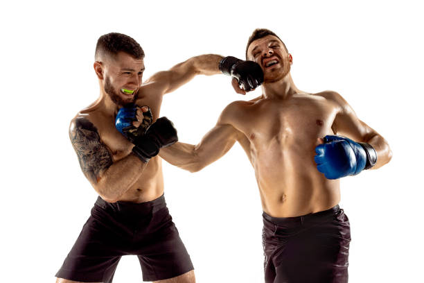 istock Two professional boxers boxing isolated on white studio background 1140153121