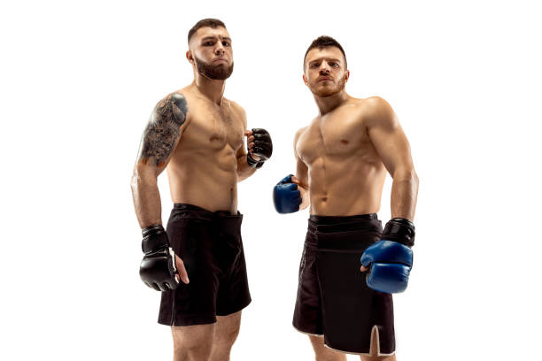 istock Two professional boxers boxing isolated on white studio background 1140153125