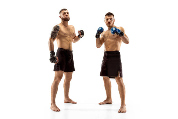 istock Two professional boxers boxing isolated on white studio background 1140153129