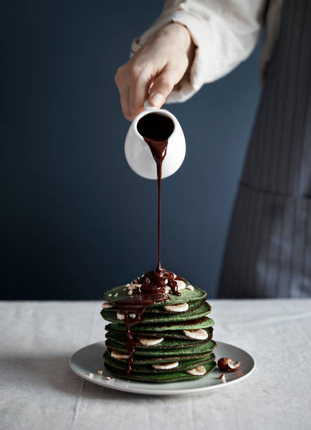 istock Green pancakes with chocolate at breakfast 1140154946