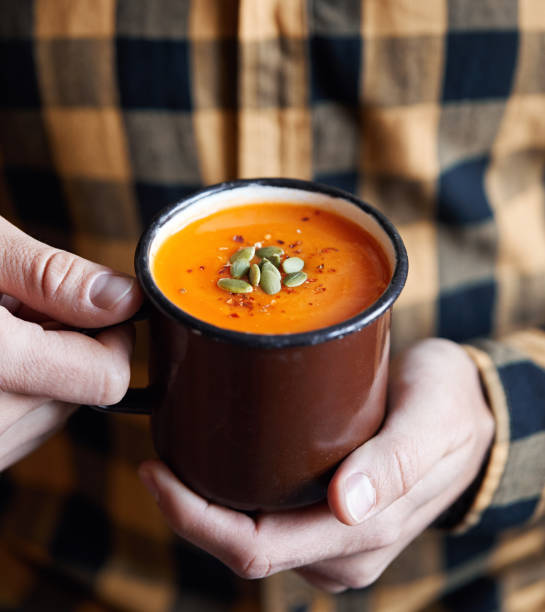 istock pumpkin cream soup in the rustic mug 1140156307