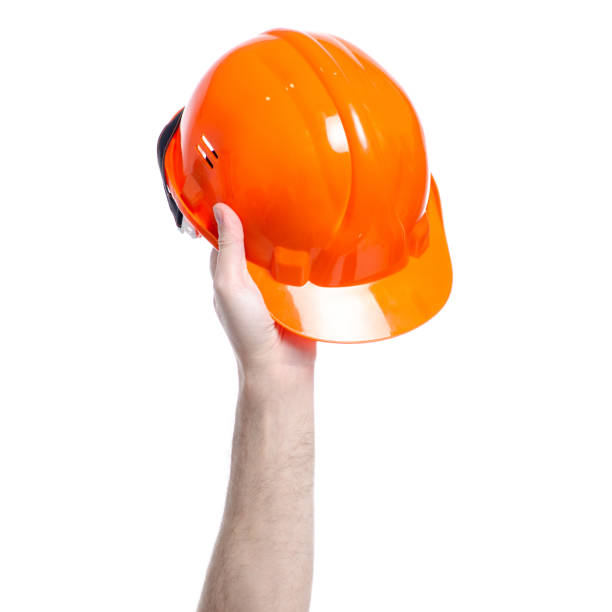 istock Helmet hard hat in hand 1140157293