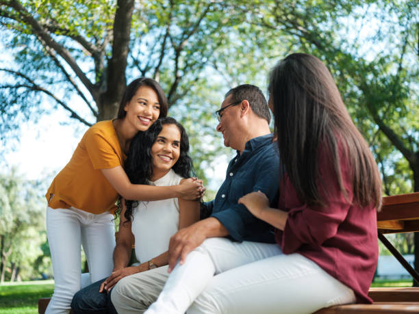 istock Mother and father sitting with their daughters 1140158120