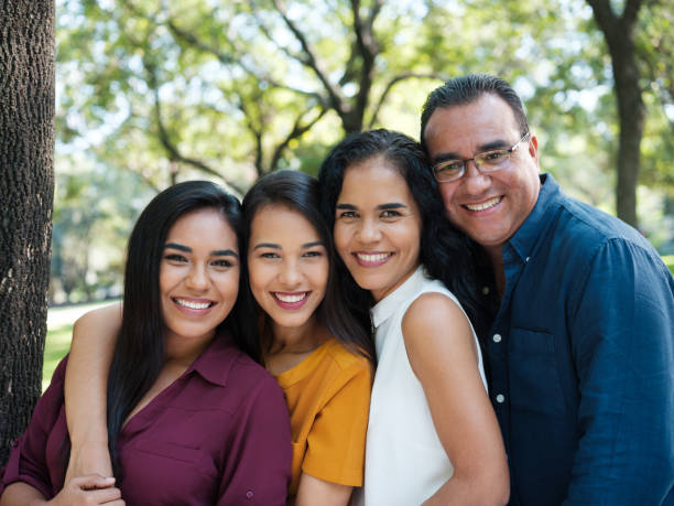 istock Lovingl latin family looking at camera 1140158135