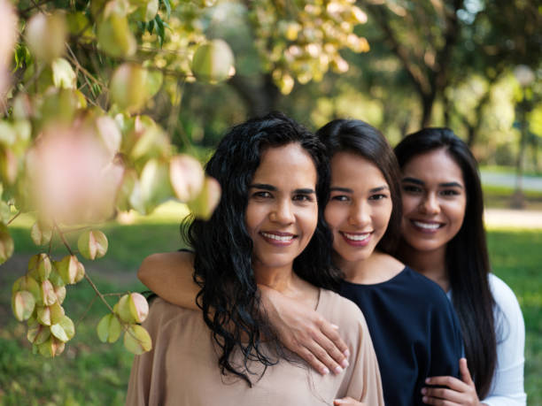 istock A mother standing in front of her two daughters looking at the camera 1140158196
