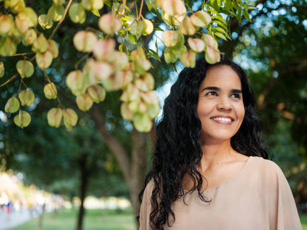 istock Mature woman standing outdoors looking away from the camera 1140158211
