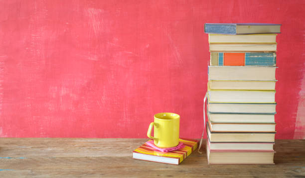 istock stack of books and cup of coffee, reading, learning, education concept, panoramic format, good copy space 1140158291