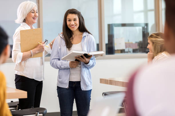 istock Smiling female student prepares to give book report 1140162121