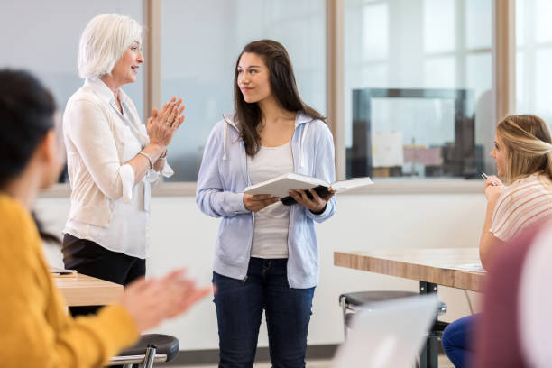 istock Student prepares to give speech in front of class 1140162128