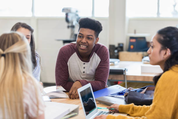 istock Confident teenage boy leading study group 1140162131