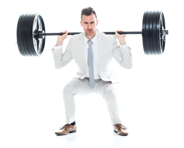 istock Handsome businessman is lifting weights 1140162787