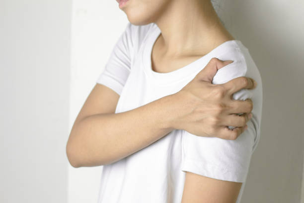 istock Woman with pain in shoulder. 1140165126