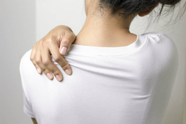 istock Woman with pain in shoulder. 1140165142