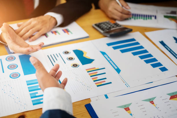 istock Group of business people discussing project plan together with analyzing data financial report in meeting room. Finance accounting concept. 1140165589