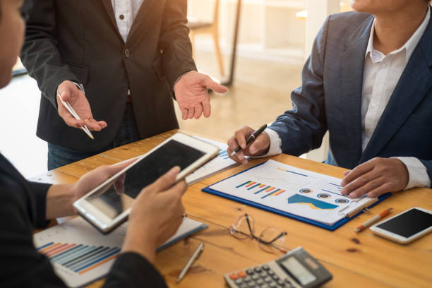istock Group of business people meeting communication discussion about analyzing data financial report in office. Accounting concept. 1140165772