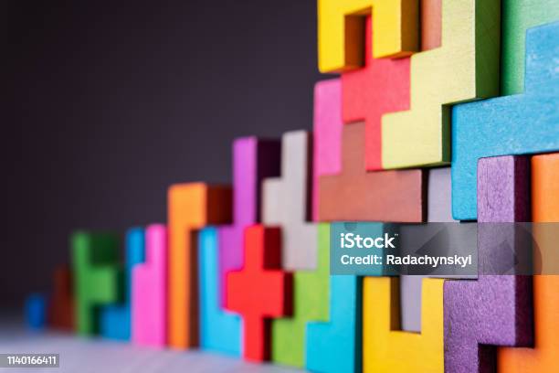Geometric Shapes On A Wooden Background Stock Photo - Download Image Now - Teamwork, Abstract, Strategy